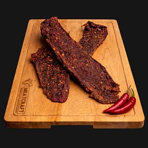 Chilli Biltong 500g – whole grass-fed beef, handcrafted and air-dried with fiery chilli spices.